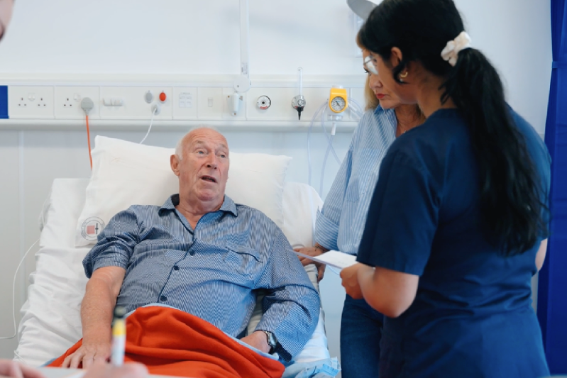 A simulated medical patient during a practical teaching session at Queen's